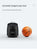 PT-Mini Pro app-controlled tennis trainer ball machine for solo training launcher size next to a basketball