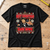 Black Best Christmas Hans Down T-Shirt laid flat on an oak workbench