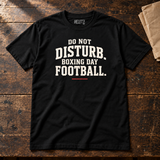 DO NOT DISTURB. BOXING DAY FOOTBALL. black Christmas slogan T-shirt — workbench flat lay