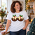 Woman wearing the white NEWTZ Cheeky Christmas Puddings T-shirt at a Christmas get-together