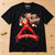 Elvis-inspired Sleigh Me Tender Christmas T-shirt – flat on workshop bench