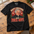 Father Jack-inspired Christmas T-shirt on an oak studio workbench