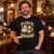 Man wearing the black NEWTZ Fleece Navidad Christmas T-shirt