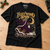 Fleetwood Snow Christmas T-shirt lying flat on an oak studio workbench
