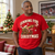 Gunning for Christmas Football T-Shirt — man wearing the red tee at home for Christmas