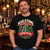 Man wearing the black NEWTZ Nakatomi Christmas Party Yippee Ki-Yay T-shirt