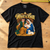 Roy Keane What a Baby Christmas T-Shirt — Black flat lay on an oak workbench