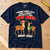 Navy Two Deer Christmas T-Shirt laid flat on a wooden workbench