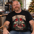 Yule Fighters Christmas T-shirt worn by a rock fan beside a turntable at home